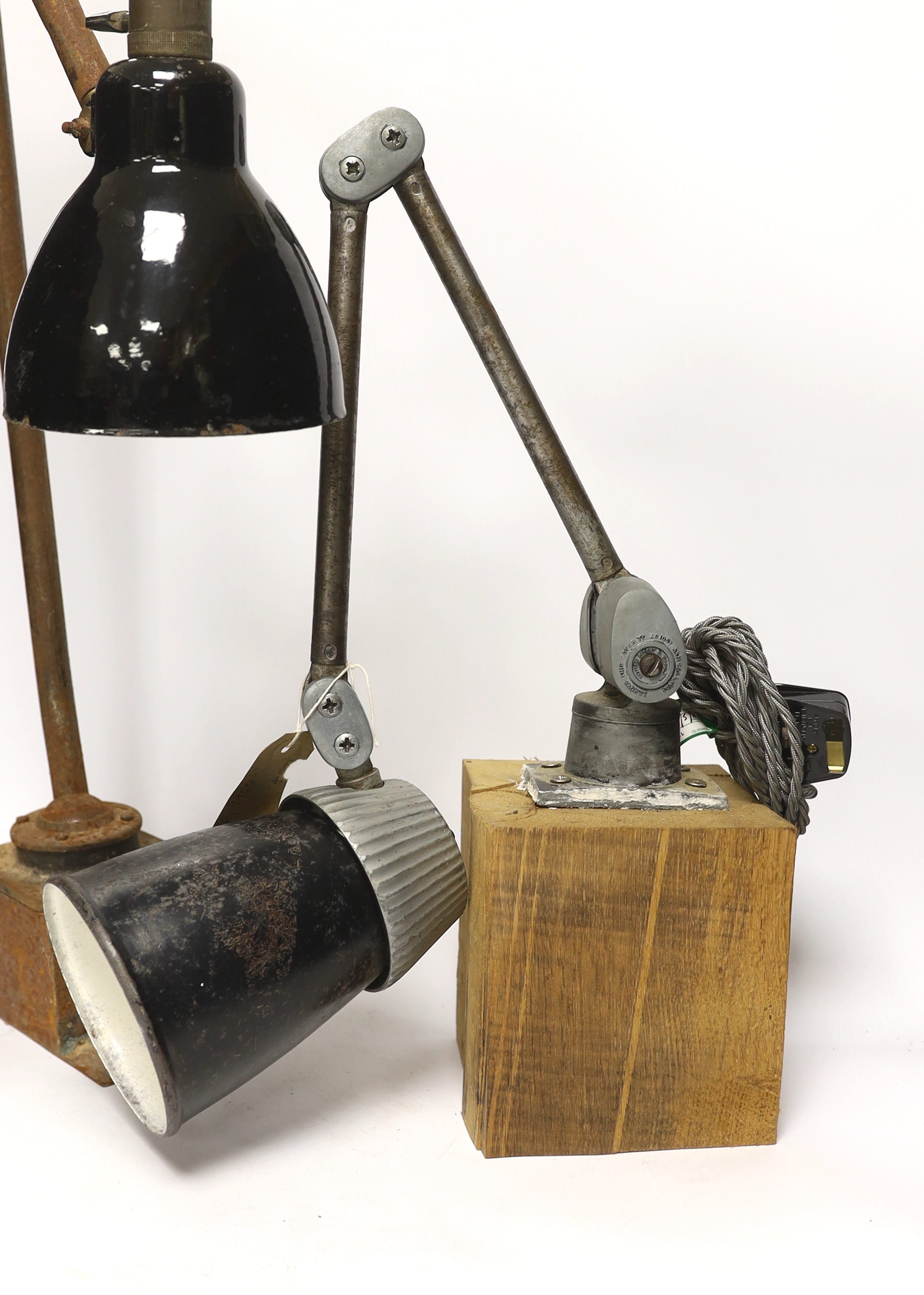 A mid-century Kaiser Idell-style scissor-action wall lamp, and two other industrial wall lamps